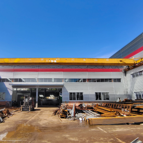 Q235 Steel Structure Warehouse with Sloping Roof and Hot-Rolled Steel Construction for Durable Storage Solutions